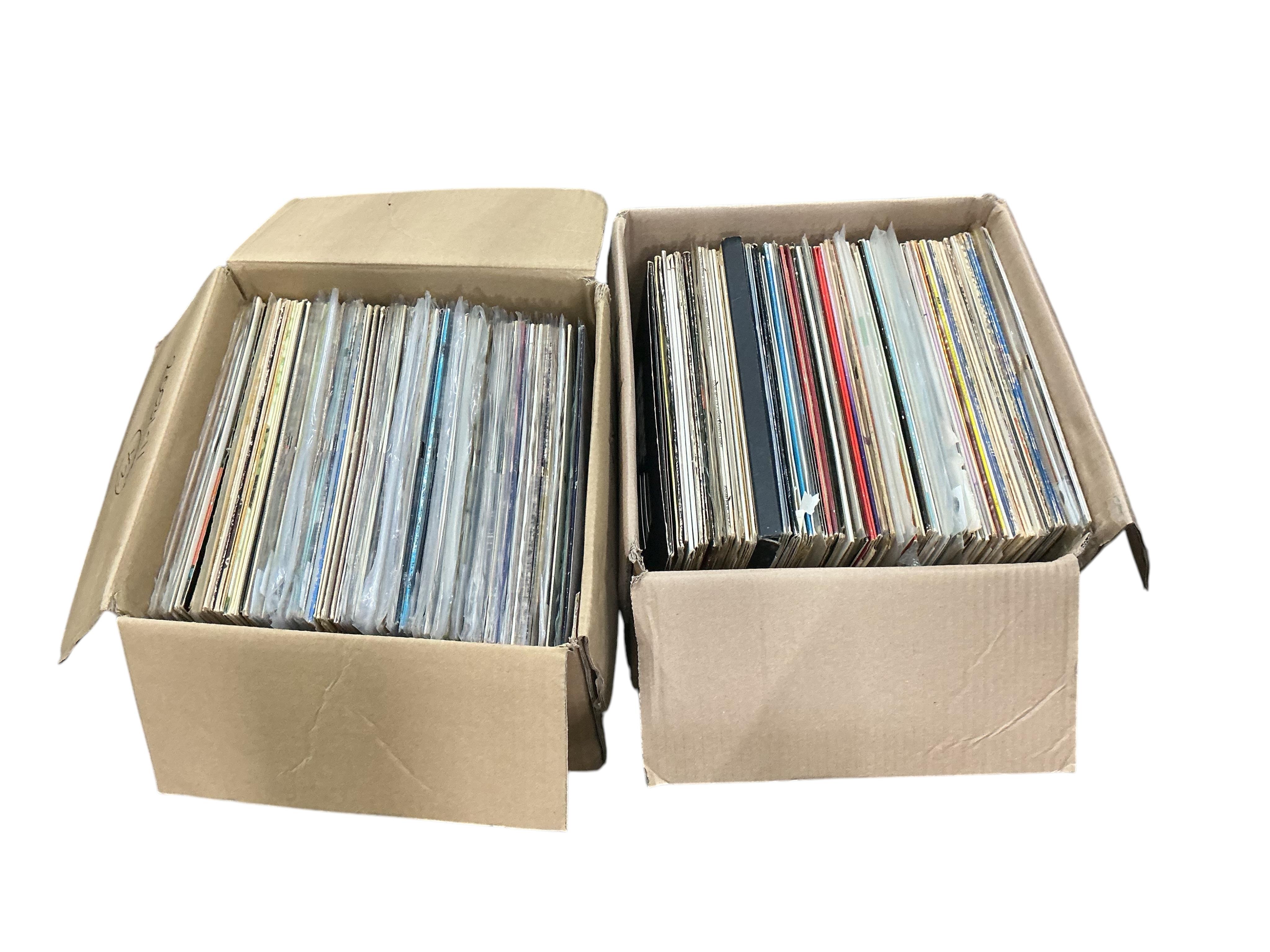 Two boxes of jazz LP record albums, artists including; Herbie Mann, Bill Evans, Ray Charles, Jerry Mulligan, Jelly Roll Morton, Art Farmer, Jimmy Smith, Frank Rosolino, Spike Robinson, Bud Shank, etc.